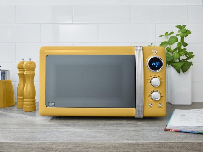 yellow microwave and kettle